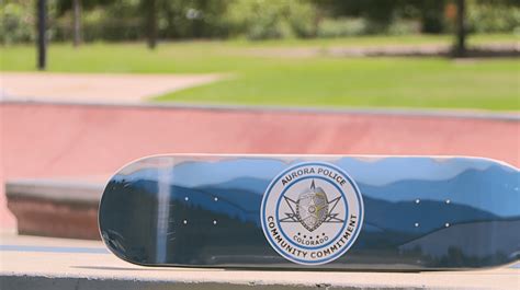 Aurora police officers gift custom skateboards to community